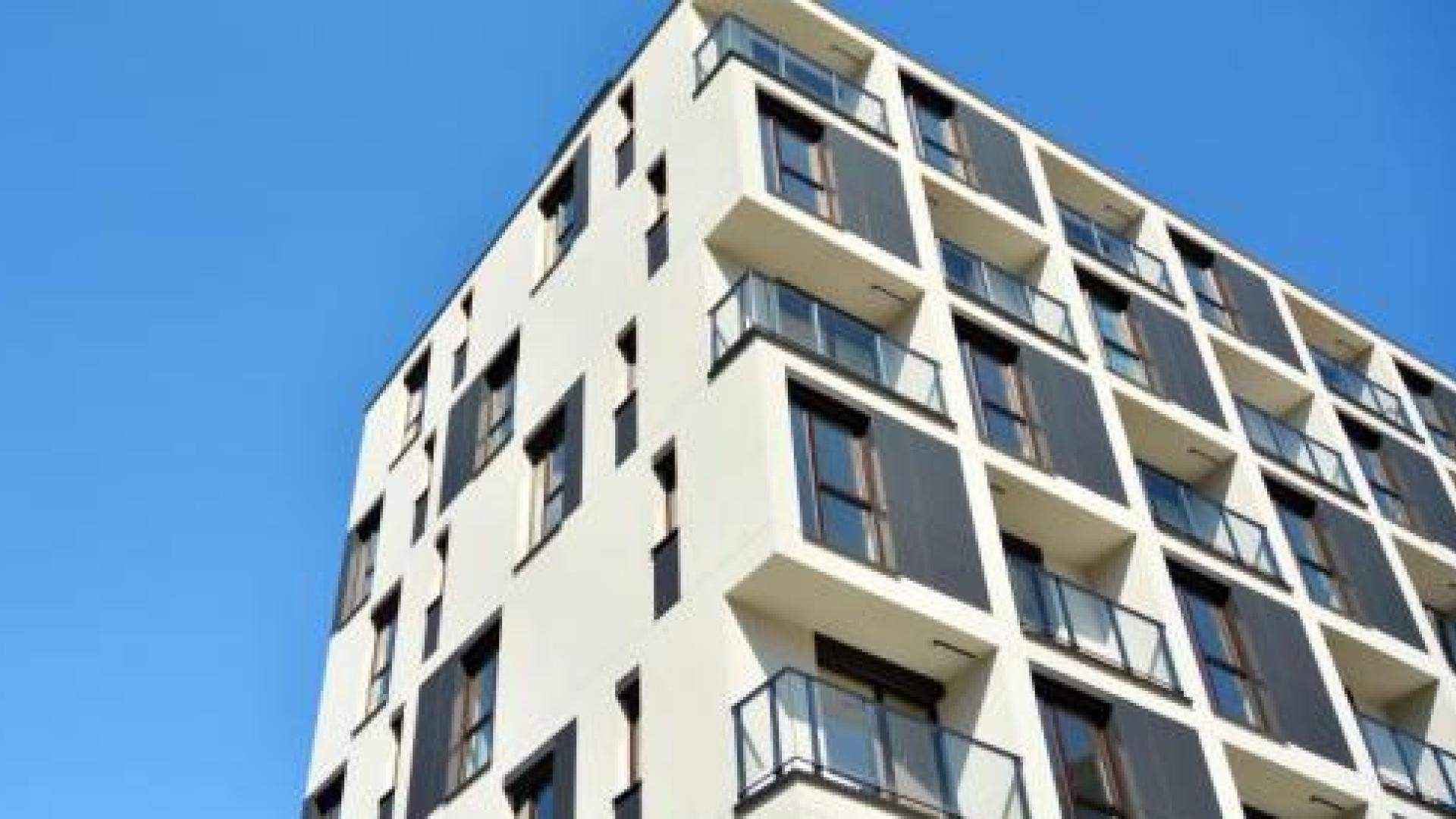 Multistory apartment building and a blue sky in the background