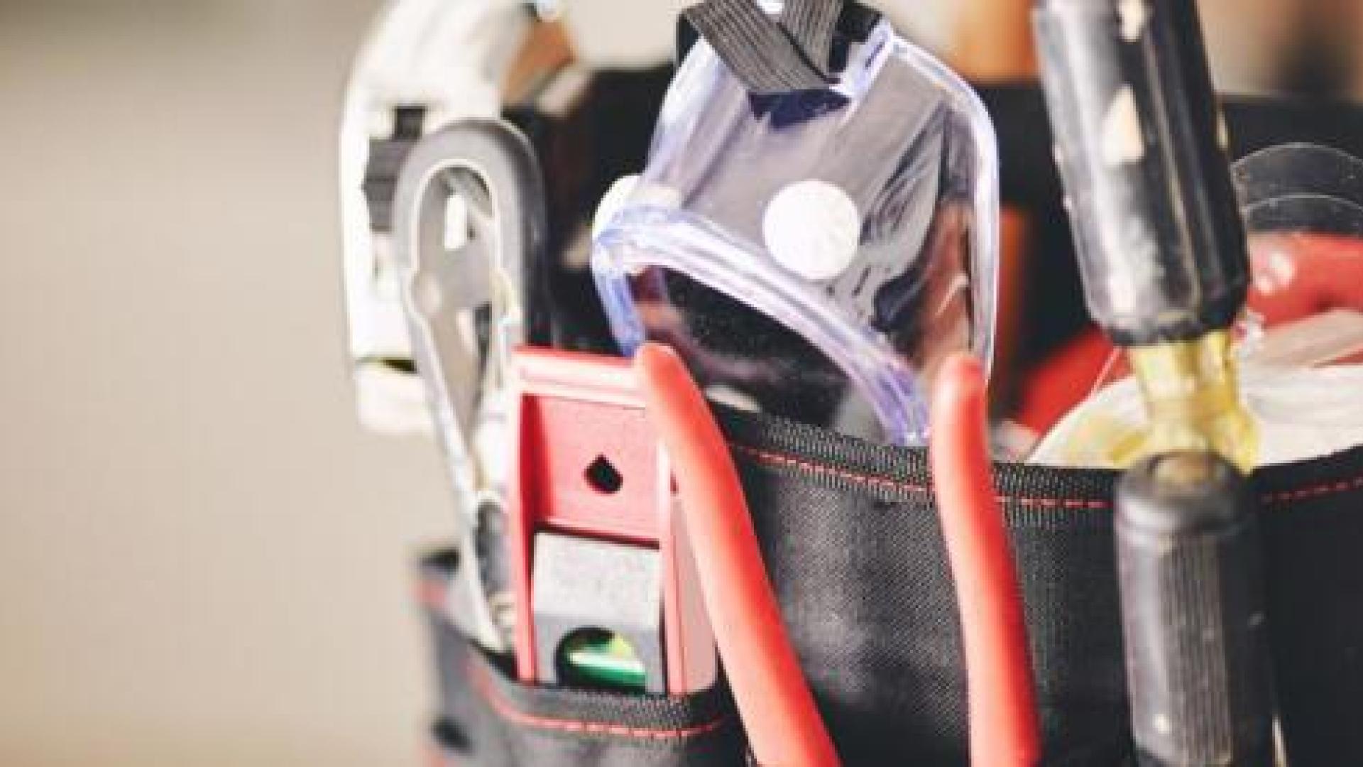A toolbelt with assorted tools for home repair