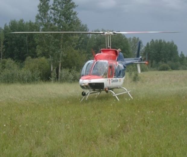 Helicopter landed on the Taiga Plains