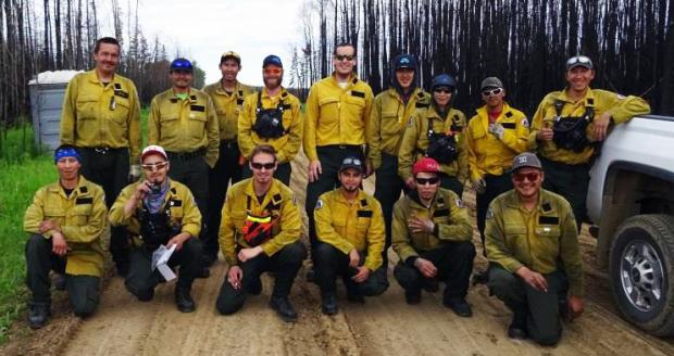 A group of NWT firefighters pose for a group photo.